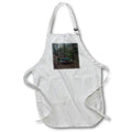 Apron - Photograph of an iron table and set of chairs hidden in the woods. Stamp City - landscape