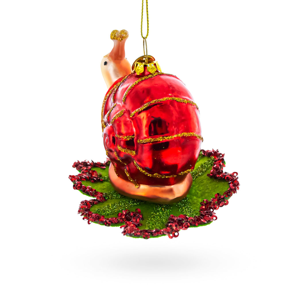 Snail Perched on a Green Leaf Glass Christmas Ornament